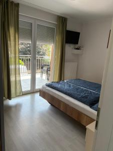 Posteľ alebo postele v izbe v ubytovaní Kohl Wellness Apartman