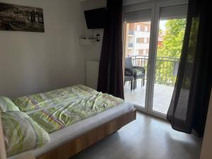 Posteľ alebo postele v izbe v ubytovaní Kohl Wellness Apartman