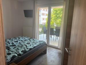 Posteľ alebo postele v izbe v ubytovaní Kohl Wellness Apartman