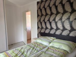 Posteľ alebo postele v izbe v ubytovaní Kohl Wellness Apartman