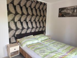 Posteľ alebo postele v izbe v ubytovaní Kohl Wellness Apartman