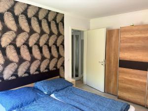 Posteľ alebo postele v izbe v ubytovaní Kohl Wellness Apartman