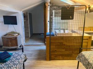 a room with a bird cage in a room at Maison de Village in Canet d'Aude