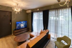 Televisyen dan/atau pusat hiburan di 1日1組限定の3階建て貸切宿 AIRSTAR Second
