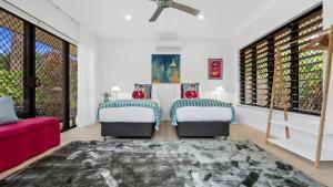 Letto o letti in una camera di The Pavilion at Trinity Beach