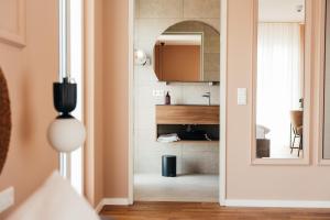 a door leading into a living room with a fireplace at beppo Restaurant Boutique-Hotel in Backnang
