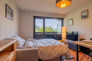 Postel nebo postele na pokoji v ubytování Studio au pied des pistes Vue imprenable Grand Bo'