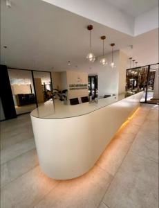 a lobby with a white counter in a building at Bamboo 754 in Ts'ikhisdziri