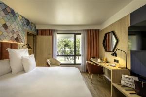 Rúm í herbergi á Barceló Fès Medina