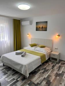 Ένα ή περισσότερα κρεβάτια σε δωμάτιο στο Casa COMAN