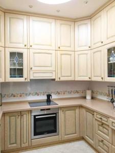 a kitchen with white cabinets and a stove top oven at Villa Sol Los Cristianos in Los Cristianos +42 photos