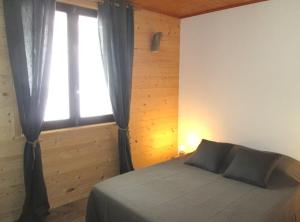 Postel nebo postele na pokoji v ubytování Chalet l'Igloo - 14 personnes