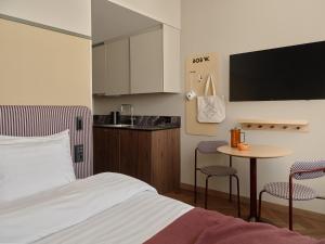 Voodi või voodid majutusasutuse Bob W Helsinki Kamppi toas