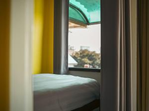 Ein Bett oder Betten in einem Zimmer der Unterkunft Stamps Backpackers