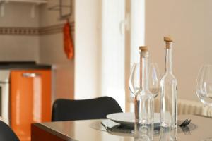 two empty wine bottles sitting on a table at Casa Peonia in Germignaga