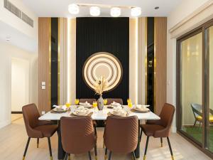 a dining room with a white table and chairs at Dubai Eye & Palm View #JBR Beach # ULTRA Luxurious 2 BHK in Dubai
