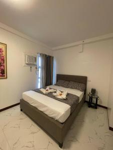 Postel nebo postele na pokoji v ubytování Spacious Fully Furnished 2BR Condo in Mactan + 37 fotografií