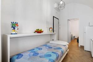 Postel nebo postele na pokoji v ubytování Lubrense Signature Suites