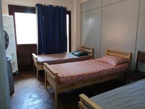 Ένα ή περισσότερα κρεβάτια σε δωμάτιο στο Hostel e café da Lobo