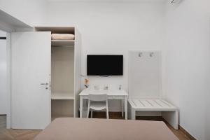 TV a/nebo společenská místnost v ubytování Lubrense Signature Suites