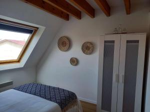 Ένα ή περισσότερα κρεβάτια σε δωμάτιο στο Duplex idéal pour 4 pers. avec balcon à Stella-Plage, proche commerces et plage - FR-1-236-102