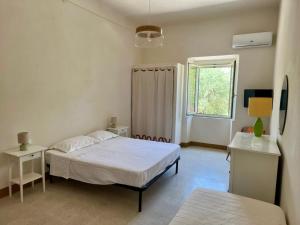 Postel nebo postele na pokoji v ubytování Case Vacanze Buonivini + 40 fotografií