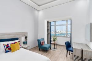Un ou plusieurs lits dans un hébergement de l'établissement Marina Bay City Center