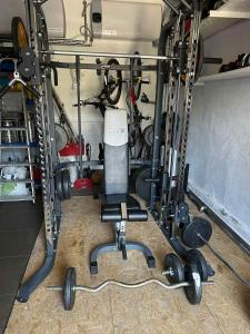 a garage with a room with a gym with equipment at Apartmány Zuzana in Primošten