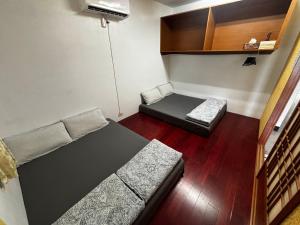 Postel nebo postele na pokoji v ubytování Lanyu Yishanan B&B
