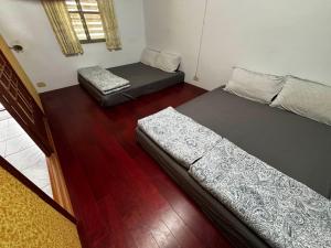 Postel nebo postele na pokoji v ubytování Lanyu Yishanan B&B