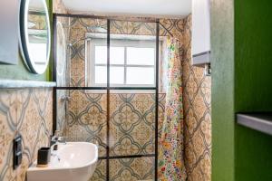 a bathroom with a sink and a window at Apartamenty za Leśniczówką in Stegna +52 photos