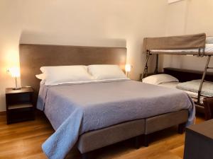 Postel nebo postele na pokoji v ubytování B&B dai Mimmi