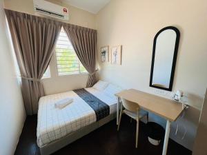 a bedroom with a bed and a desk and a mirror at myROOM @ Mandalay Georgetown, Off Jln Burma, Gurney Drive in George Town