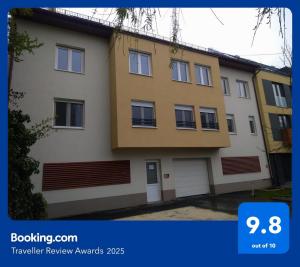 a picture of a building with the number at Blonde River Apartman Móra Szeged in Szeged