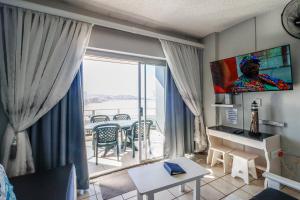 TV a/nebo společenská místnost v ubytování Seagull 303