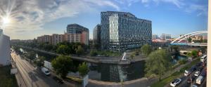 a view of a city with a river and buildings at Studio București in Bucharest