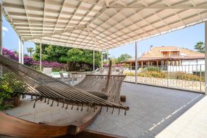 a couple of hammocks on a patio at Il Giardino di Venere in Mondello