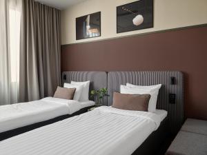 Voodi või voodid majutusasutuse Bob W Helsinki Kamppi toas