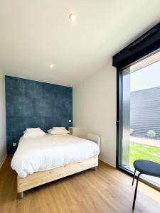 Ліжко або ліжка в номері EcoCampus du Comminges