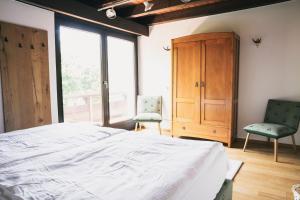 Postel nebo postele na pokoji v ubytování Villa Werdenberg