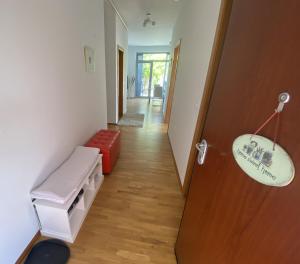 a hallway with a room with a door and a bench at Apartments Apolon Izola in Izola +40 photos