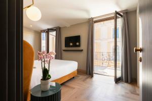 Postel nebo postele na pokoji v ubytování Je Rome Hotel