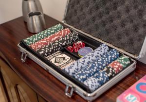 an open suitcase sitting on a table with dominoes at The Lothian Road Residence in Edinburgh