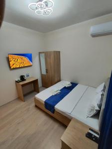 Ένα ή περισσότερα κρεβάτια σε δωμάτιο στο Anhor Hotel +8 φωτογραφίες