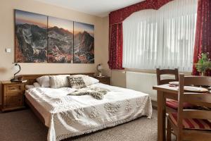 Posteľ alebo postele v izbe v ubytovaní Willa Kocham Tatry