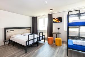 Postel nebo postele na pokoji v ubytování a&o Berlin Mitte
