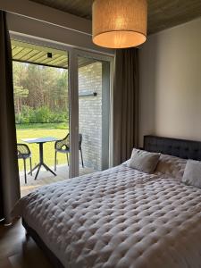 En eller flere senge i et værelse på Monciskes Apartment Seaside