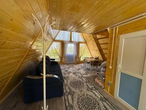a living room with a couch and a table at Guest House Shirin in Barskoon