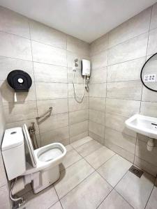 a bathroom with a toilet and a sink at myROOM @ Mandalay Georgetown, Off Jln Burma, Gurney Drive in George Town +37 photos