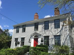 an old white house with a red door at Samuel Durfee House in Newport